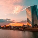 Stunning sunset over Frankfurt's skyline featuring the iconic ECB Tower and Main River.